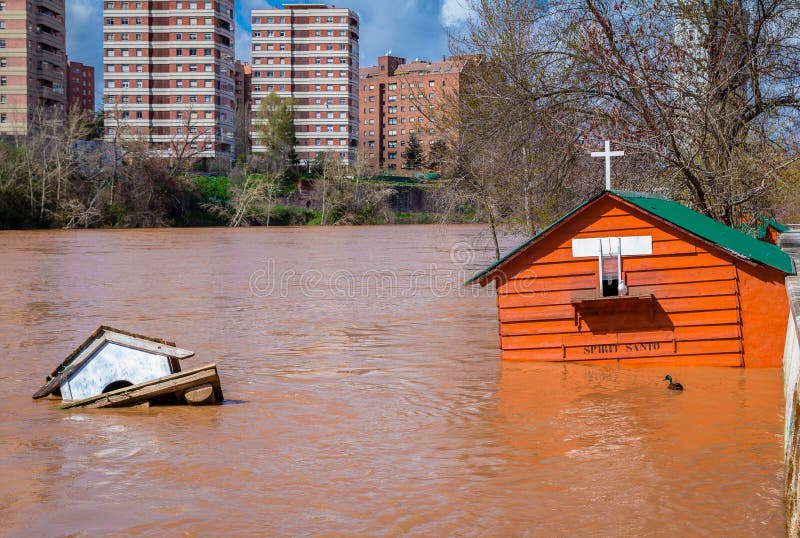 House by the river drown by a flooding river. House by the river drown by a flooding river.