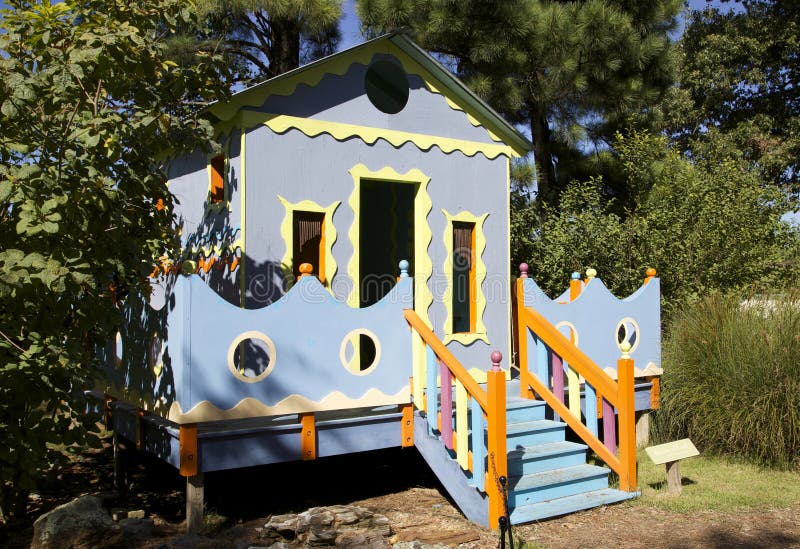 A colorful blue, orange, grey and yellow children's play toy house. A colorful blue, orange, grey and yellow children's play toy house.