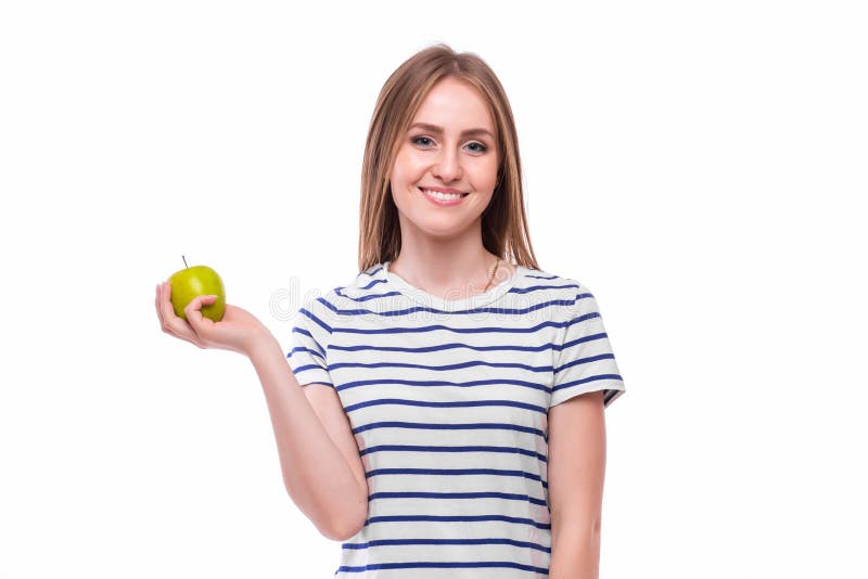 Het jonge meisje eet appel Vrouwelijke tanden en appel stock afbeeldingen Het jonge meisje eet appel Vrouwelijke tanden en appel stock afbeeldingen