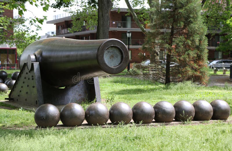 BROOKLYN, NEW YORK - MAY 20, 2015: 20 inch Parrott Cannon of 1864 as a Civil War Memorial in Bay Ridge area of Brooklyn, New York. It was the largest muzzle-loading cannon ever forged on US soil. BROOKLYN, NEW YORK - MAY 20, 2015: 20 inch Parrott Cannon of 1864 as a Civil War Memorial in Bay Ridge area of Brooklyn, New York. It was the largest muzzle-loading cannon ever forged on US soil