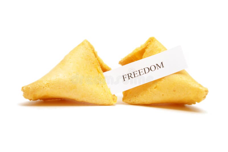 A cracked open fortune cookie stating the word freedom. A cracked open fortune cookie stating the word freedom.
