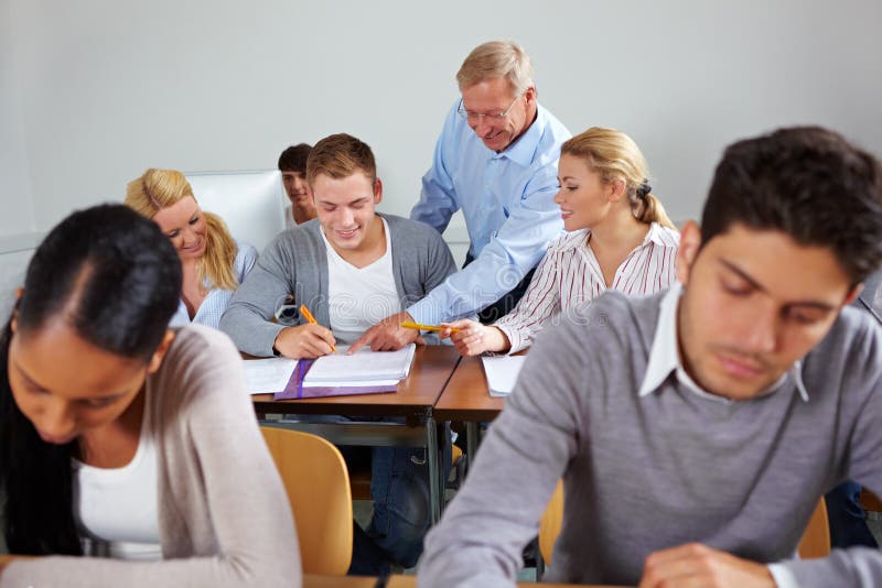 Students learning together in class at university. Students learning together in class at university