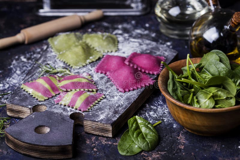 Making homemade ravioli with spinach and beets and stuffed seafood. Making homemade ravioli with spinach and beets and stuffed seafood