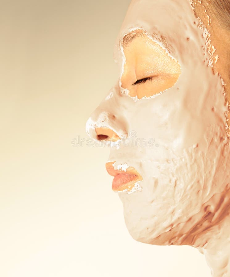 Woman in a health spa wearing a facial mask. Woman in a health spa wearing a facial mask