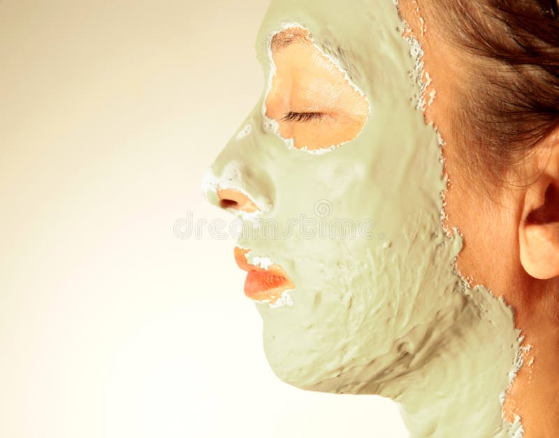 Woman in a health spa wearing a facial mask. Woman in a health spa wearing a facial mask