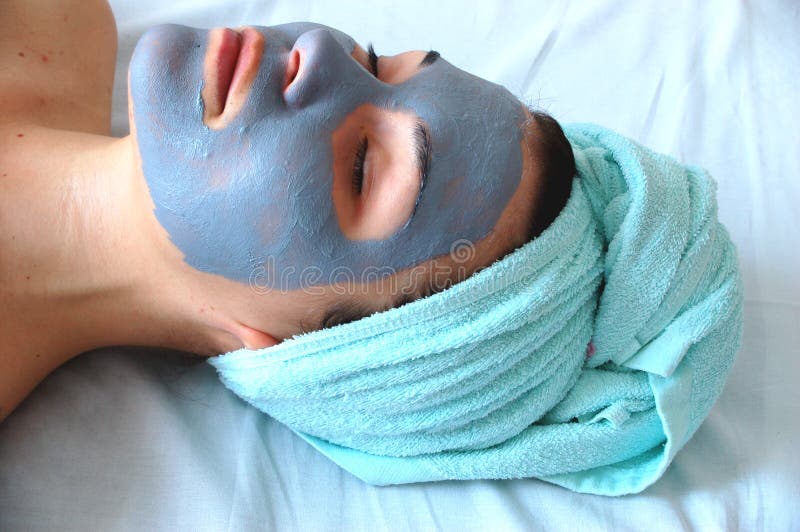 Attractive woman in blue facial mask. Attractive woman in blue facial mask