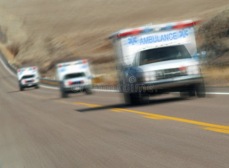 Ambulances rushing down the highway. Ambulances rushing down the highway