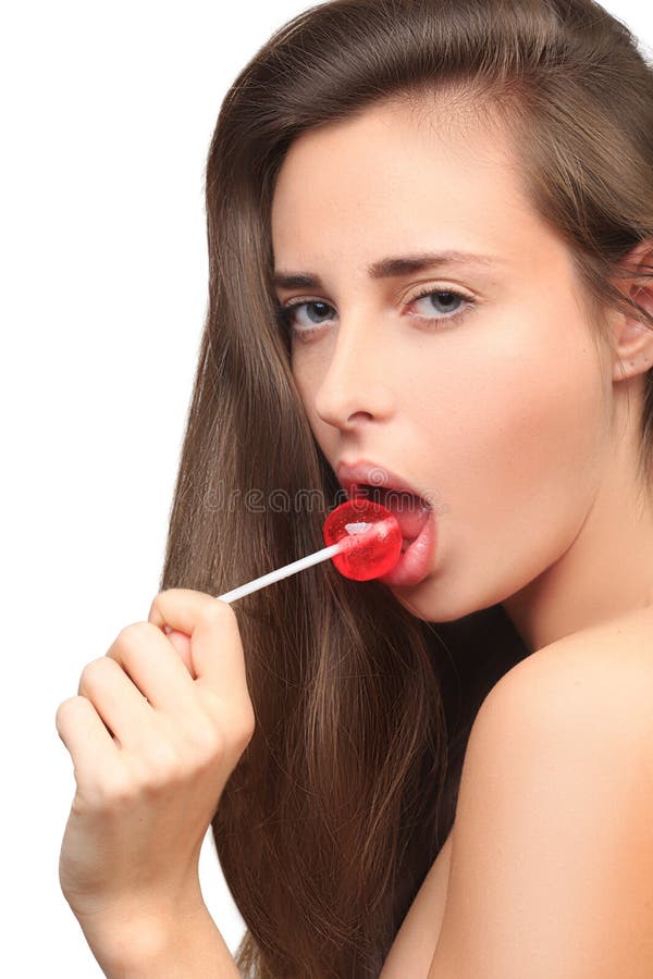 Het meisje met mooi haar zuigt een lolly royalty-vrije stock fotografie Het meisje met mooi haar zuigt een lolly royalty-vrije stock fotografie