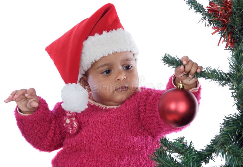 Het meisje van de baby het spelen met Kerstmisboom stock afbeelding Het meisje van de baby het spelen met Kerstmisboom stock afbeelding