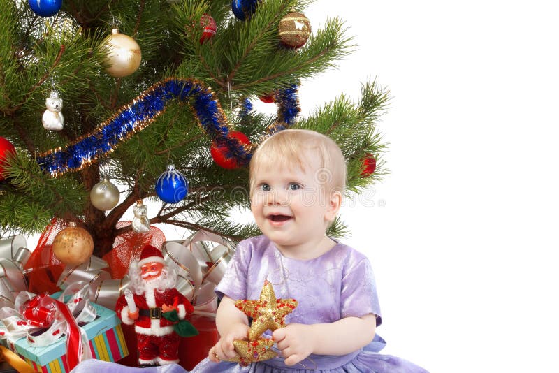 Het meisje van de baby onder de Kerstboom royalty-vrije stock fotografie Het meisje van de baby onder de Kerstboom royalty-vrije stock fotografie