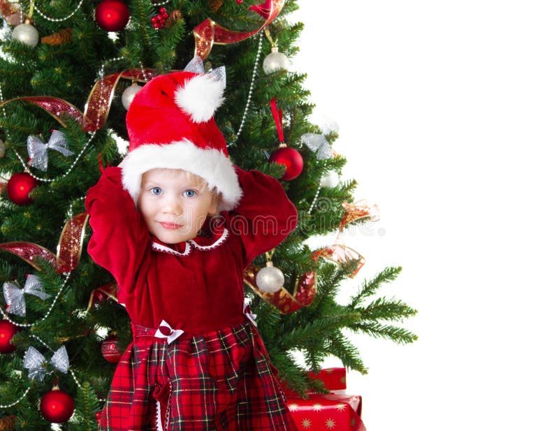 Het meisje van de baby onder de Kerstboom stock afbeelding Het meisje van de baby onder de Kerstboom stock afbeelding