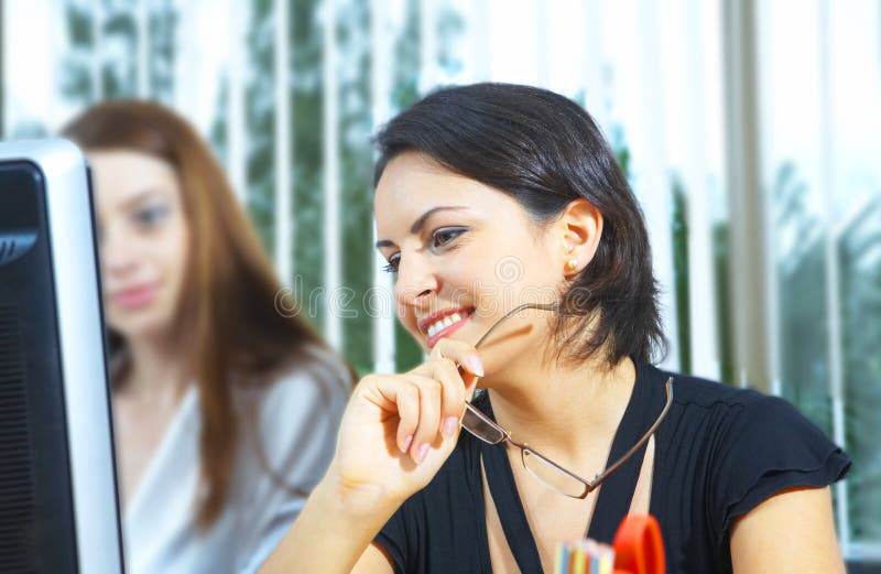 View of nice brunette operator at her working place. View of nice brunette operator at her working place