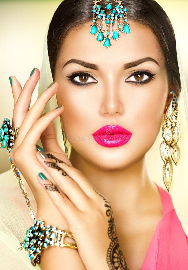 Beautiful fashion Indian woman portrait with oriental jewels. Beautiful fashion Indian woman portrait with oriental jewels