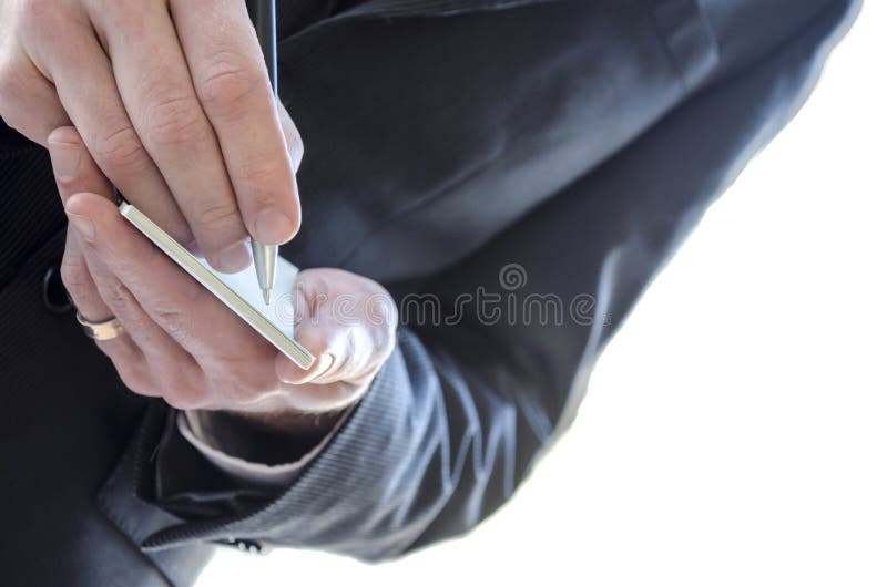 Detail of a business man holding a pan to start taking notes. Detail of a business man holding a pan to start taking notes.