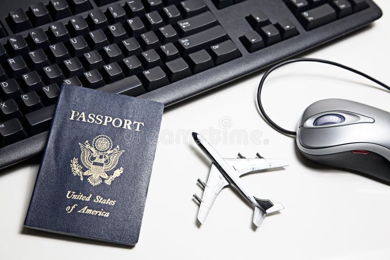 Computer mouse, toy airplane, passport and keyboard placed on a white tabletop. Computer mouse, toy airplane, passport and keyboard placed on a white tabletop.