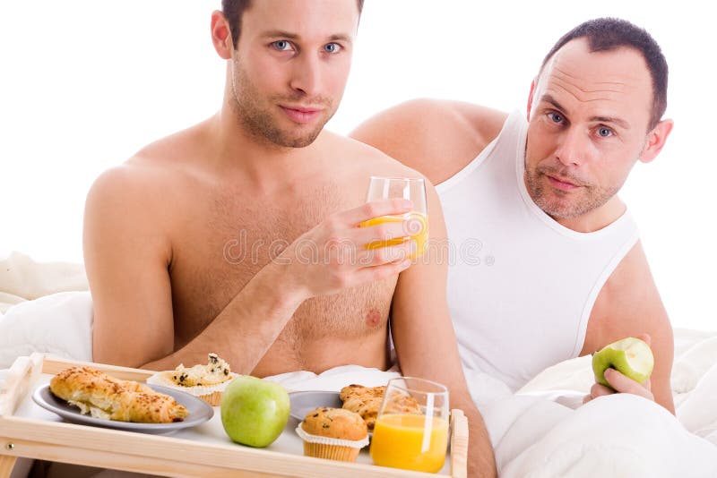 Het paar van Homo geniet van hun ontbijt stock afbeelding Het paar van Homo geniet van hun ontbijt stock afbeelding