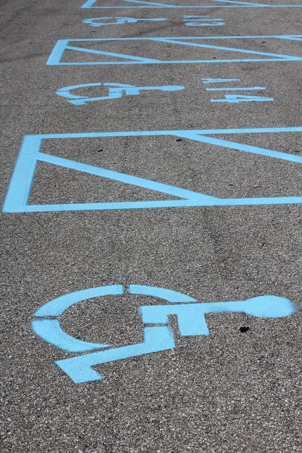 Handicap parking spaces in a parking lot. Handicap parking spaces in a parking lot.