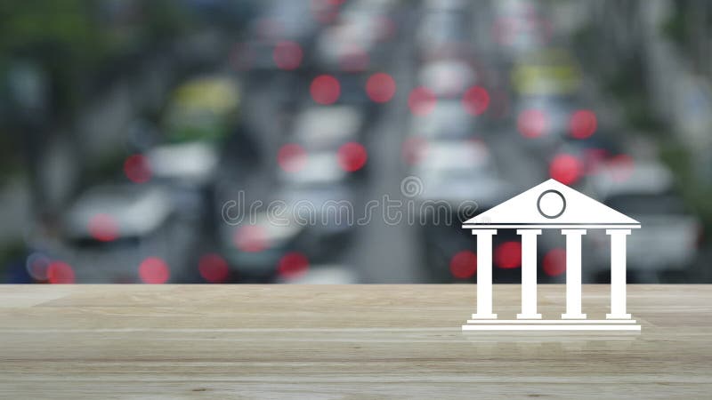 Het platte pictogram op een houten tafel boven de onduidelijke spits van spitsuur met auto's en weg in de stad, het online concep