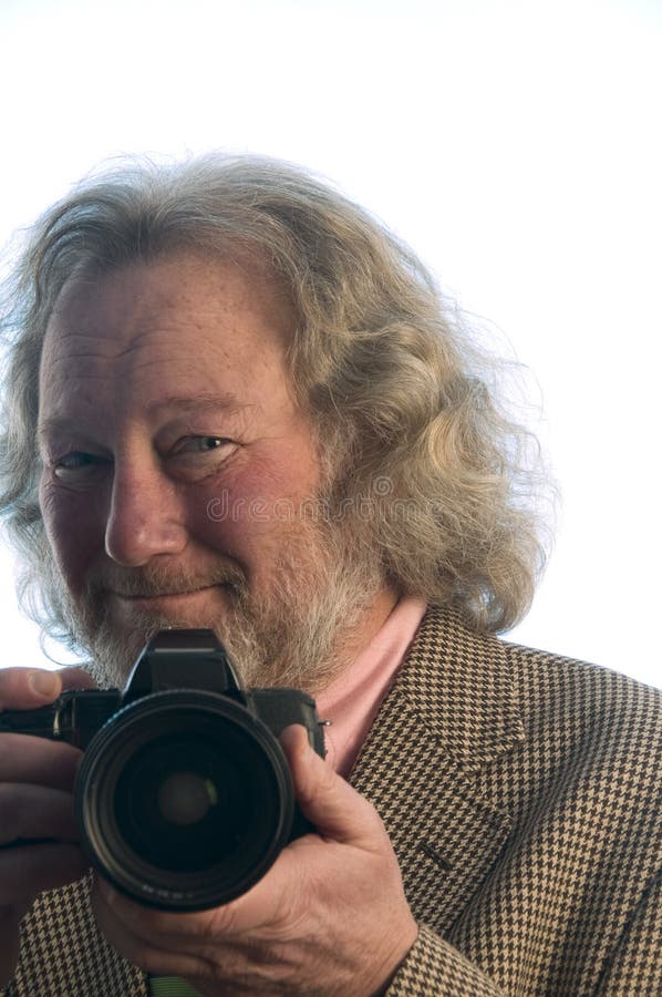 Het professionele lange haar van de fotograaf hogere mens royalty-vrije stock afbeelding Het professionele lange haar van de fotograaf hogere mens royalty-vrije stock afbeelding