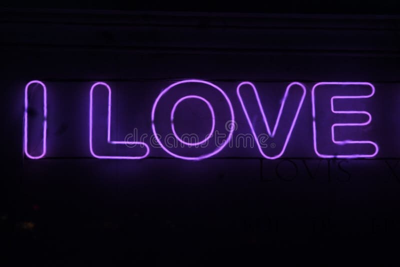 Het roze teken van het liefdeneon stock fotografie Het roze teken van het liefdeneon stock fotografie