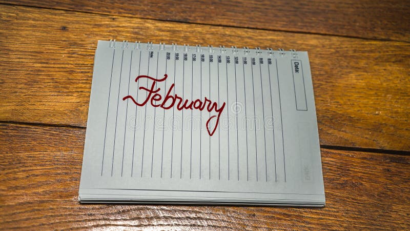 February, writing love text on paper, lovely message. Text on spiral agenda. Romantic, love concept. Valentine`s day. February, writing love text on paper, lovely message. Text on spiral agenda. Romantic, love concept. Valentine`s day