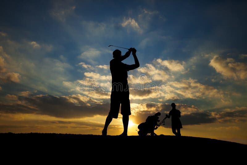 Male golfer playing golf at sunset. Male golfer playing golf at sunset