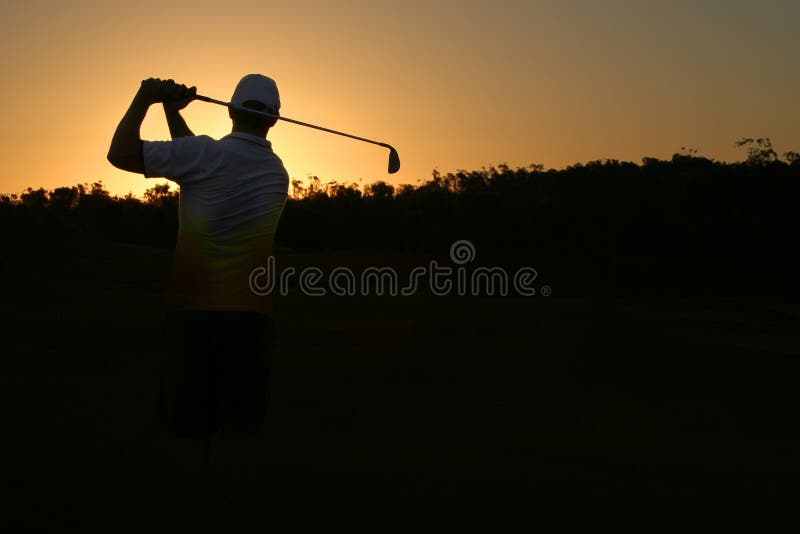 Golfer silhouette on golden sunset with black copy space. Golfer silhouette on golden sunset with black copy space