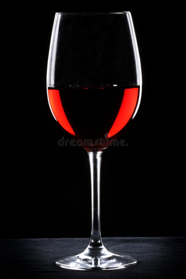 Red wine glass silhouette over black background. Red wine glass silhouette over black background