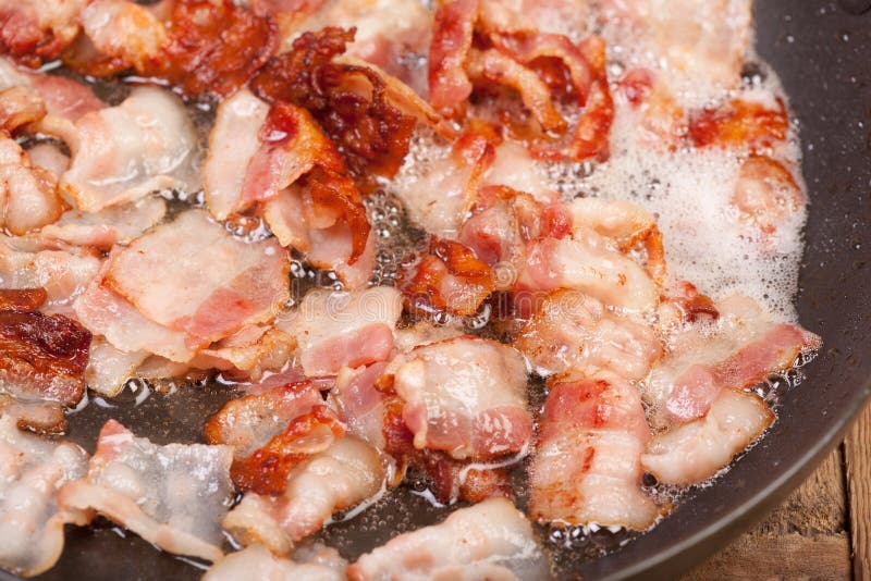Het sissen van Bacon stock afbeelding Het sissen van Bacon stock afbeelding