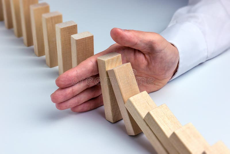 Stop Domino Effect - Hand Prevents Failure. Stop Domino Effect - Hand Prevents Failure