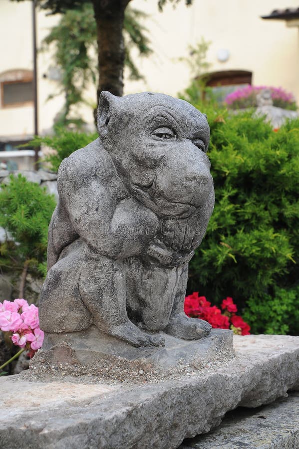 Gargoyle garden stone statue,gargouille, throat, gullet, gurgulio, gula, gargula. Gargoyle garden stone statue,gargouille, throat, gullet, gurgulio, gula, gargula