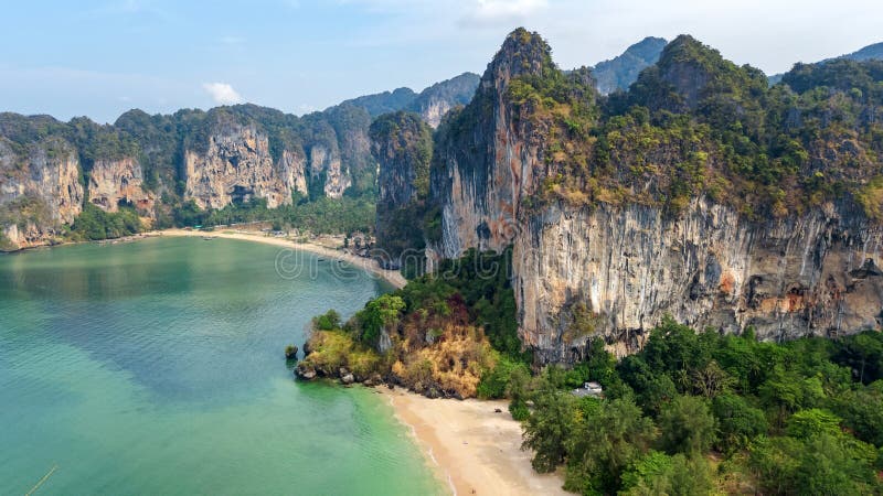 Railay beach in Thailand, Krabi province, aerial bird`s view of tropical Railay and Pranang beaches with rocks and palm trees, coastline of Andaman sea from above. Railay beach in Thailand, Krabi province, aerial bird`s view of tropical Railay and Pranang beaches with rocks and palm trees, coastline of Andaman sea from above