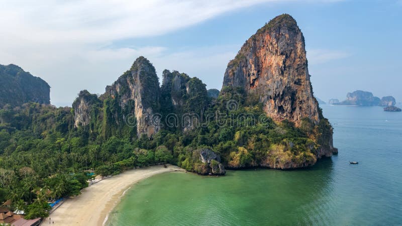 Railay beach in Thailand, Krabi province, aerial bird`s view of tropical Railay and Pranang beaches with rocks and palm trees, coastline of Andaman sea from above. Railay beach in Thailand, Krabi province, aerial bird`s view of tropical Railay and Pranang beaches with rocks and palm trees, coastline of Andaman sea from above