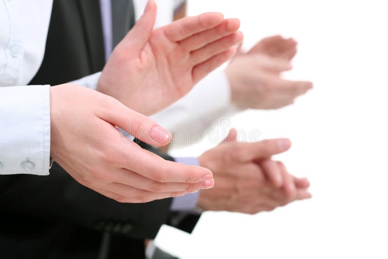 Photo of businesswomanï¿½s hands applauding at background of partners. Photo of businesswomanï¿½s hands applauding at background of partners