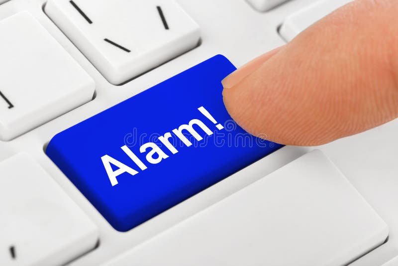 Het toetsenbord van het computernotitieboekje met Alarmsleutel royalty-vrije stock foto's Het toetsenbord van het computernotitieboekje met Alarmsleutel royalty-vrije stock foto's