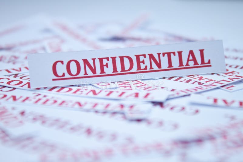 The word Confidential surrounded by some shredded papers. The word Confidential surrounded by some shredded papers.