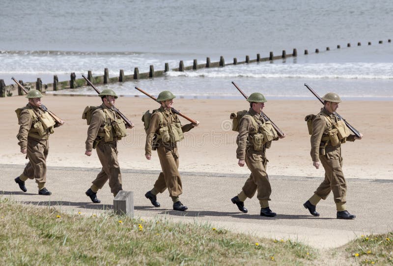 Reenactors, dressed as World War 2 British soliders in reenactment of beach landing at Blyth, Northumberland, England. UK. Reenactors, dressed as World War 2 British soliders in reenactment of beach landing at Blyth, Northumberland, England. UK.