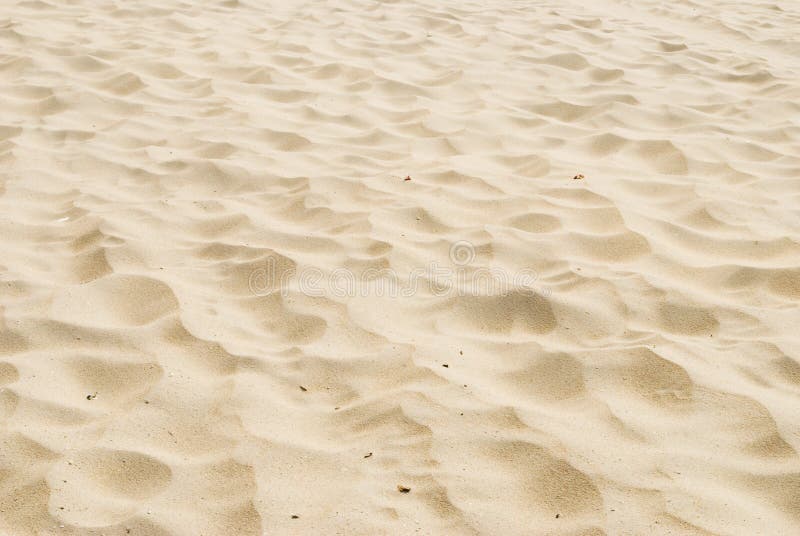 Het zand van het strand