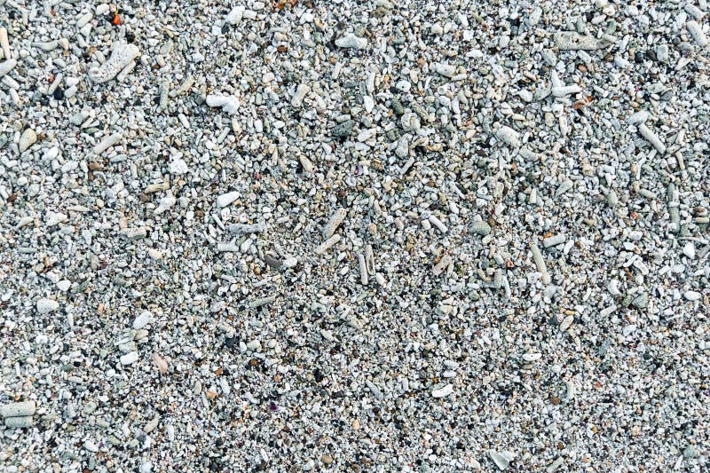 Het zandclose-up van het koraalstrand voor achtergrond royalty-vrije stock afbeelding Het zandclose-up van het koraalstrand voor achtergrond royalty-vrije stock afbeelding