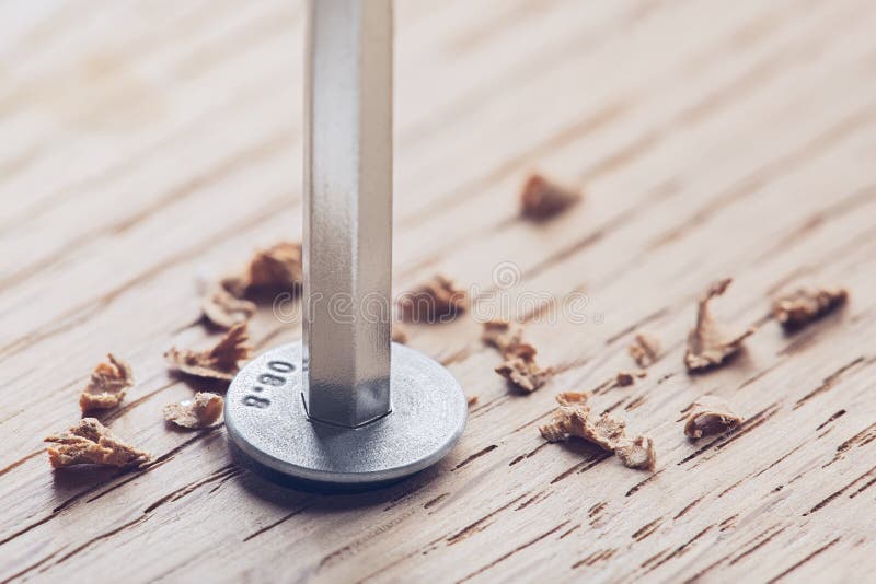 Hex Bolt by Hex Wrench in Wooden Oaks Plate. Spanner, Bolt, and Nuts Stock Image Image of