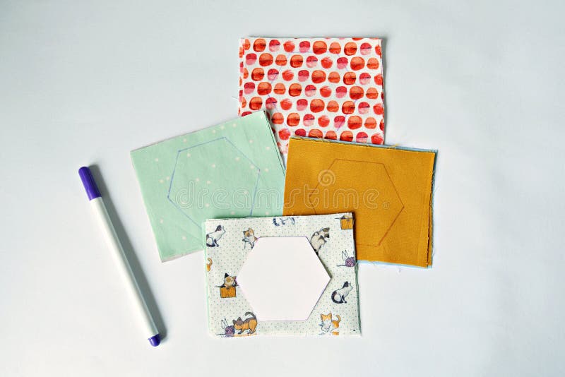 Hexagon english paper piecing templates, white cup, thread, retro scissors  and metal pins on the wooden table Stock Photo