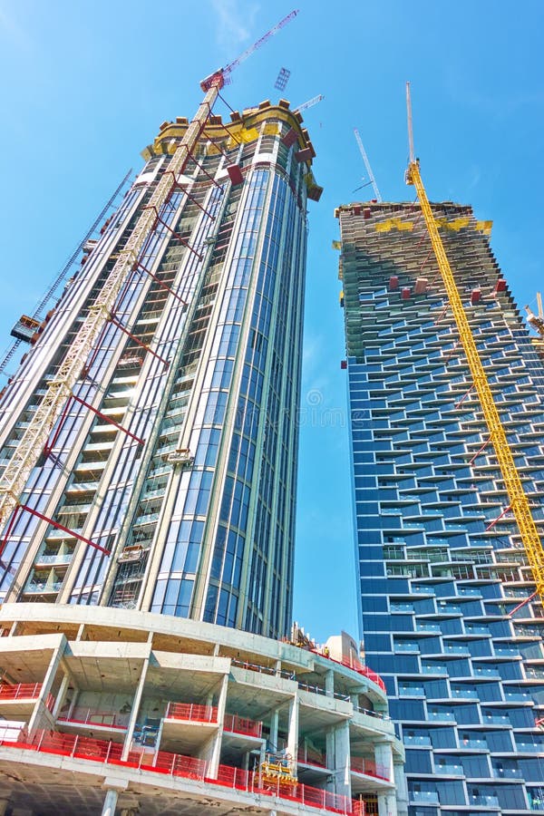 Dubai, UAE - February 01, 2020: New hi-rise buildings under construction in Downtown Dubai, United Arab Emirates. Dubai, UAE - February 01, 2020: New hi-rise buildings under construction in Downtown Dubai, United Arab Emirates