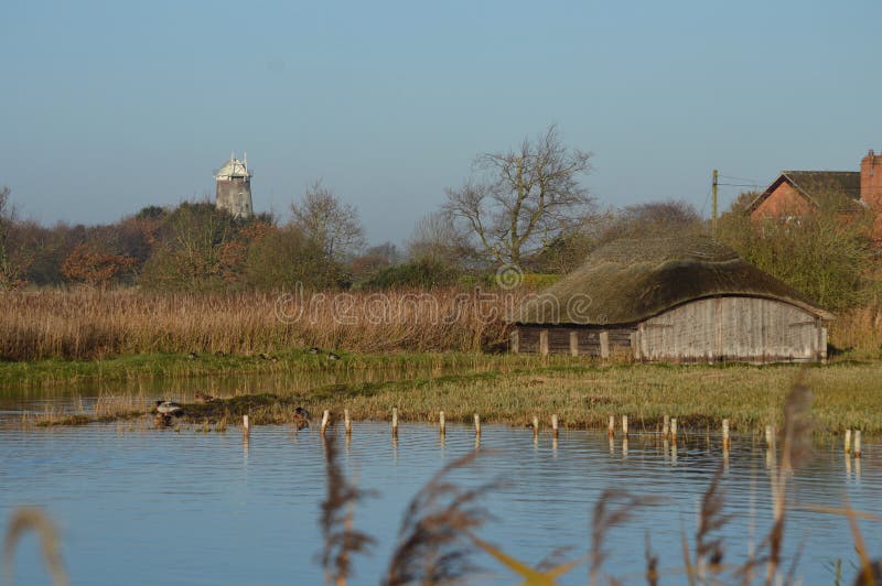 Hickling Broad Norfolk Thatched Boathouses and Windmill