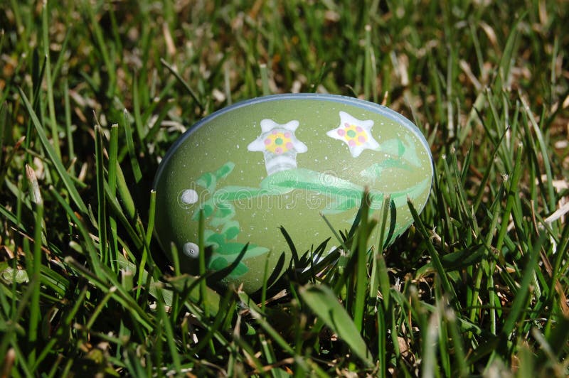Hidden Decorated Easter Egg in Spring stock photography