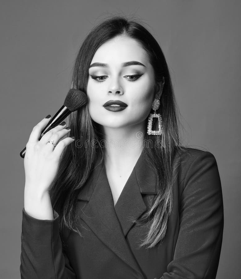 Hiding all imperfections. Perfect skin tone. Makeup artist concept. Looking good and feeling confident. Gorgeous lady stock photography Hiding all imperfections. Perfect skin tone. Makeup artist concept. Looking good and feeling confident. Gorgeous lady stock photography