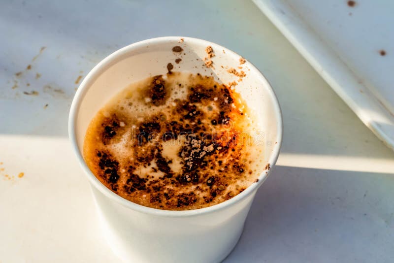 High Angle Close Up of Coffee in a Paper Cup with Sprinkled Chocolate