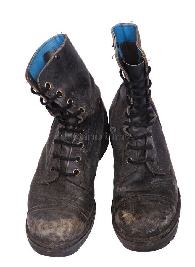 High Angle frontal view of a very worn pair of boots, issued by the Israeli army (IDF). isolated on white background. High Angle frontal view of a very worn pair of boots, issued by the Israeli army (IDF). isolated on white background.