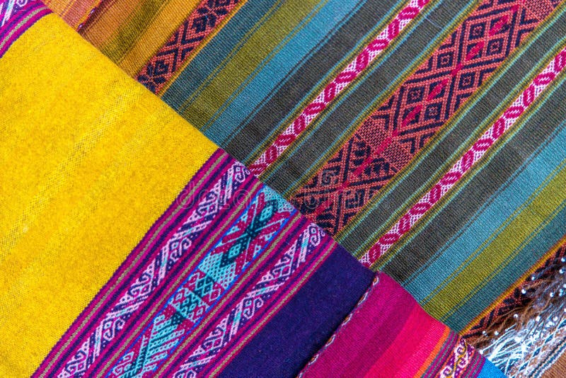 High angle shot of the beautiful and colorful handcrafted fabrics in a market stock photos High angle shot of the beautiful and colorful handcrafted fabrics in a market stock photos