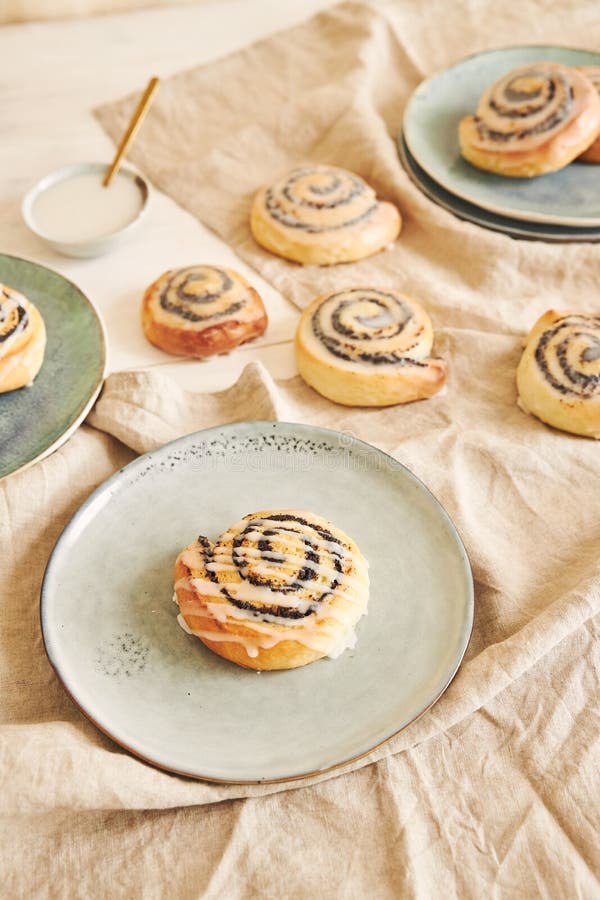High Angle Shot of Delicious Poppy Seed Rolls with a Sugar Glaze on a Table Stock Image Image