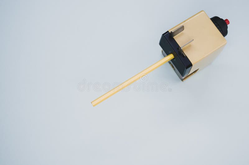 High Angle Shot of a Mechanical Pencil Sharpener on a Blue Surface